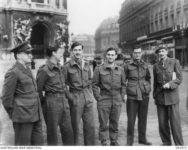 Paris, France. 1945-02-18. Group portrait of Australian war correspondents in the Place de l'Opera in Paris. Left to right: Colin Bingham, of Sydney Morning Herald; Godfrey Blunden, of Sydney Daily and Sunday Telegraph; Geoffrey Hutton, of Melbourne Argus; King Watson, of Sydney Daily and Sunday Telegraph; Henry Bateson of Truth and Sydney Daily Mirror; Colin Wills, of London News Chronicle.
